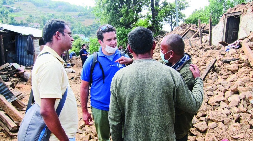 JDC volunteer, Sam Amiel, meets with JDC partners in the field in Nepal.